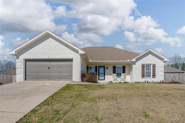 single story home with a front yard, brick siding, driveway, and an attached garage