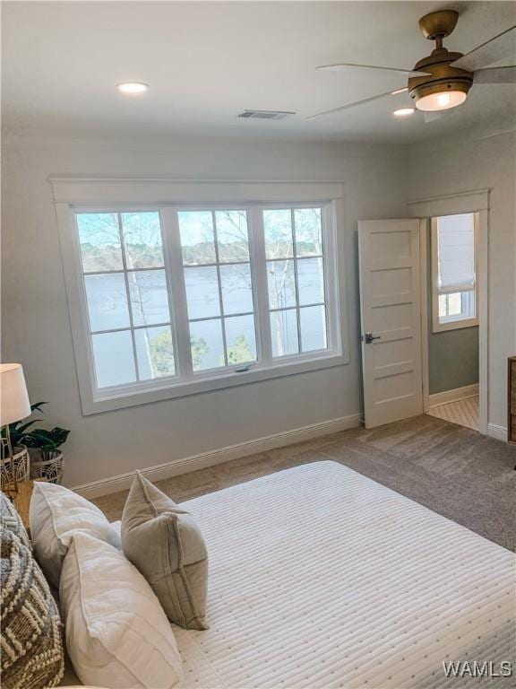 carpeted bedroom featuring ceiling fan