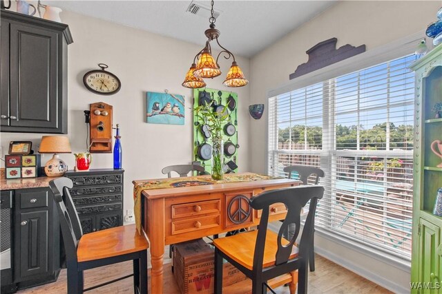 4468 21st St, Northport, AL 35476 - dining space with light wood-style flooring and baseboards