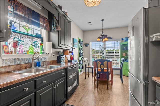 4468 21st St, Northport, AL 35476 - kitchen with freestanding refrigerator, dishwashing machine, a sink, a chandelier, and light wood finished floors