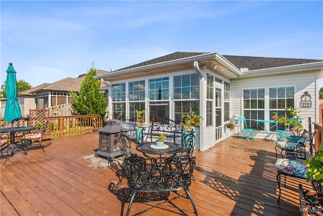 4468 21st St, Northport, AL 35476 - wooden terrace with a sunroom and outdoor dining area