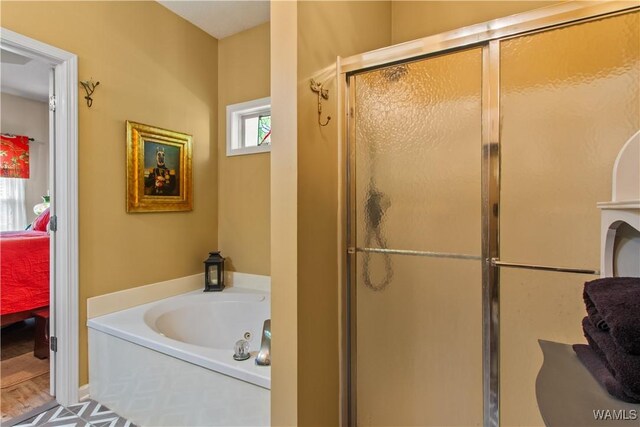 4468 21st St, Northport, AL 35476 - bathroom with a stall shower, a bath, and ensuite bath