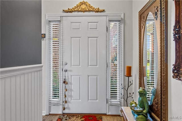 4468 21st St, Northport, AL 35476 - entrance foyer featuring wood finished floors and a wainscoted wall
