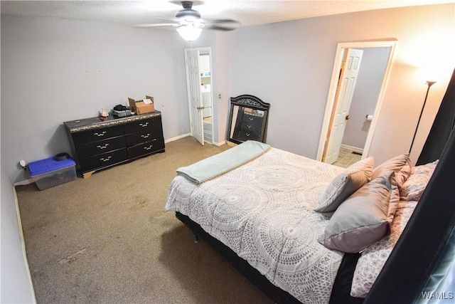 bedroom with connected bathroom and light colored carpet