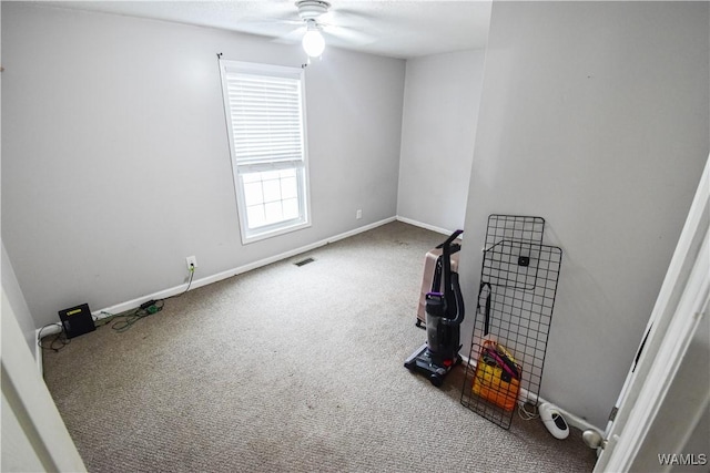 carpeted empty room with ceiling fan