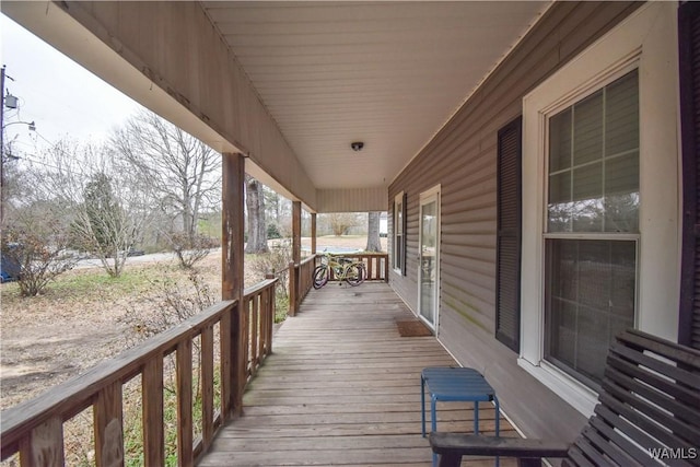 wooden terrace with a porch