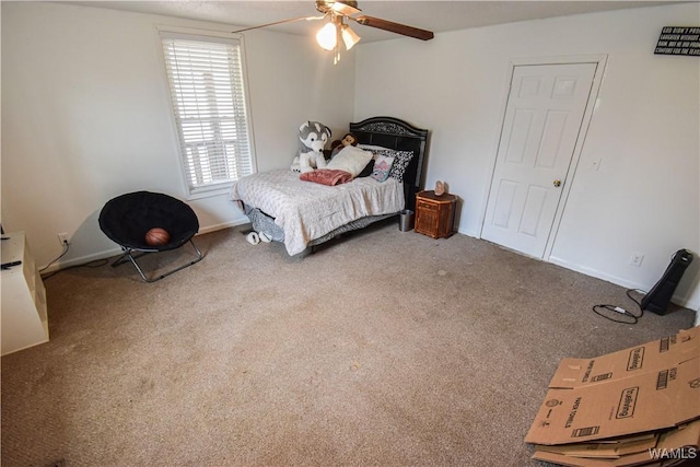 carpeted bedroom with ceiling fan