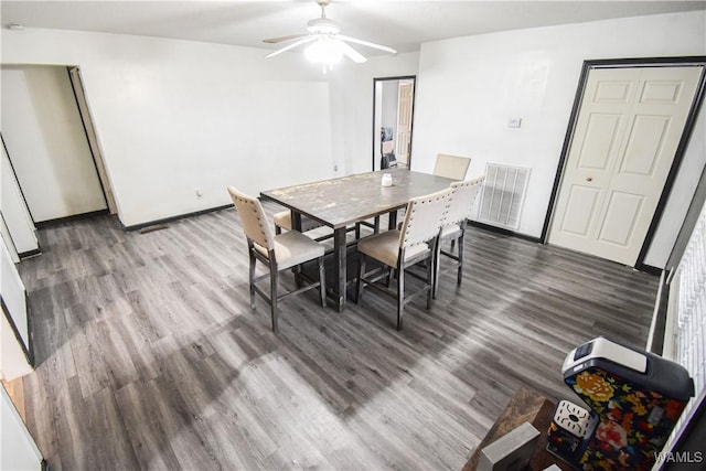 dining area featuring hardwood / wood-style flooring and ceiling fan