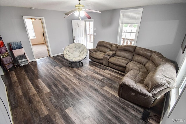 living room with ceiling fan and dark hardwood / wood-style floors