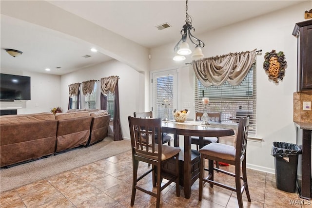 view of carpeted dining space