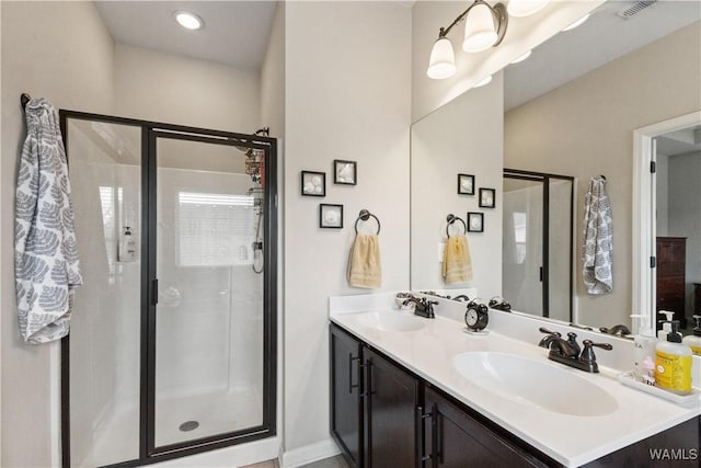 bathroom with vanity and walk in shower