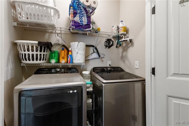 laundry area featuring washing machine and clothes dryer