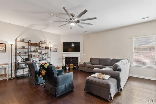 living room with dark hardwood / wood-style floors and ceiling fan