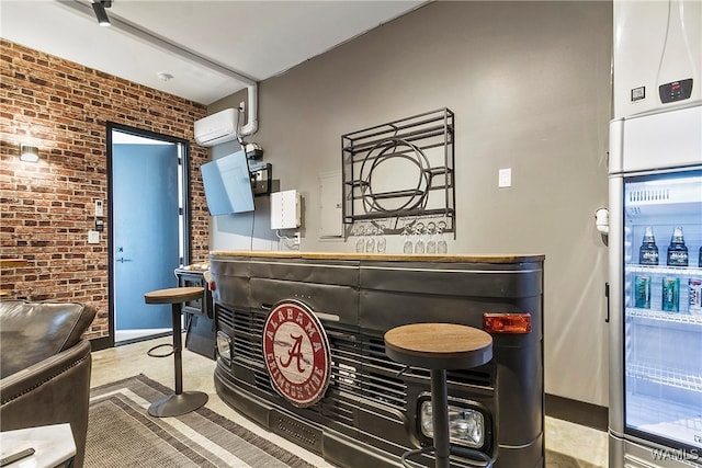 bar featuring an AC wall unit and brick wall