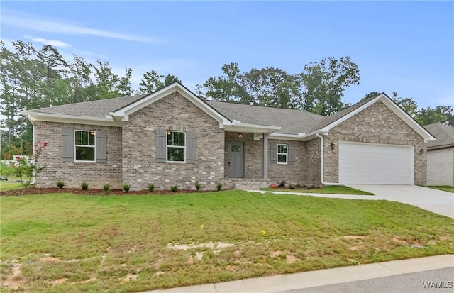 single story home with a garage, concrete driveway, brick siding, and a front yard