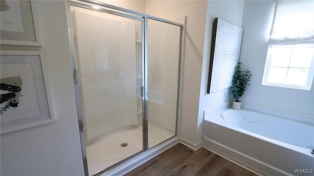 9349 Havenridge Loop, Tuscaloosa, AL 35405 - full bath with a bath, a stall shower, wood finished floors, and baseboards