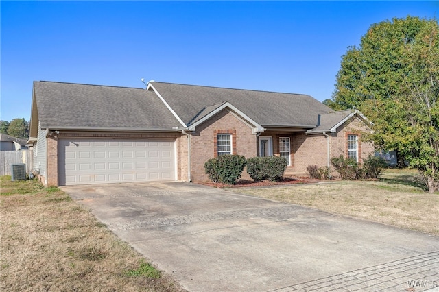 ranch-style home featuring a garage, a front yard, and central AC