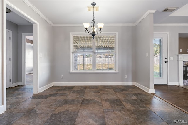 unfurnished dining area featuring crown molding, a wealth of natural light, and a notable chandelier