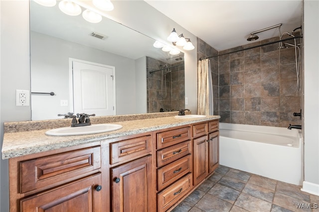 bathroom featuring shower / bath combo with shower curtain and vanity