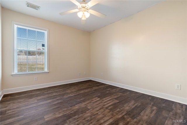 empty room featuring ceiling fan and dark hardwood / wood-style flooring