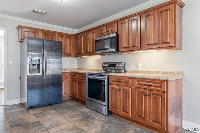 kitchen featuring stainless steel appliances and crown molding