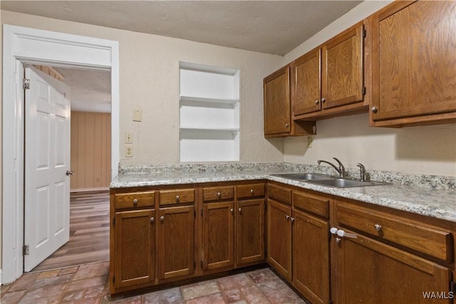 kitchen with sink and a textured ceiling