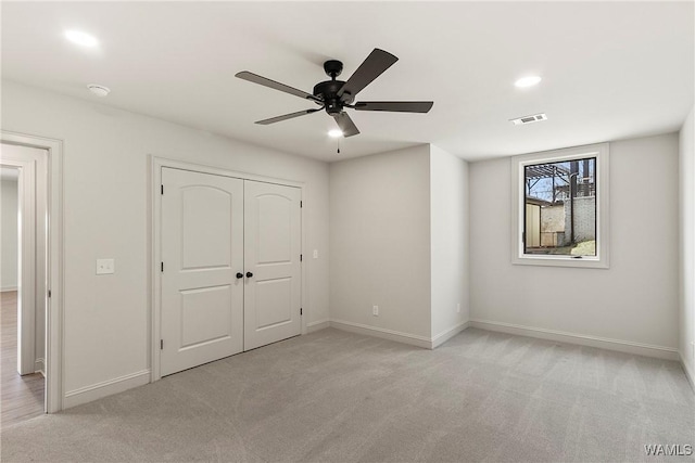 10416 Harbourtowne Dr, Northport, AL 35475 - unfurnished bedroom with light carpet, a closet, a ceiling fan, and recessed lighting