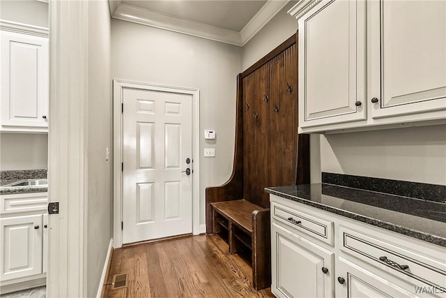 10416 Harbourtowne Dr, Northport, AL 35475 - mudroom featuring crown molding and wood finished floors