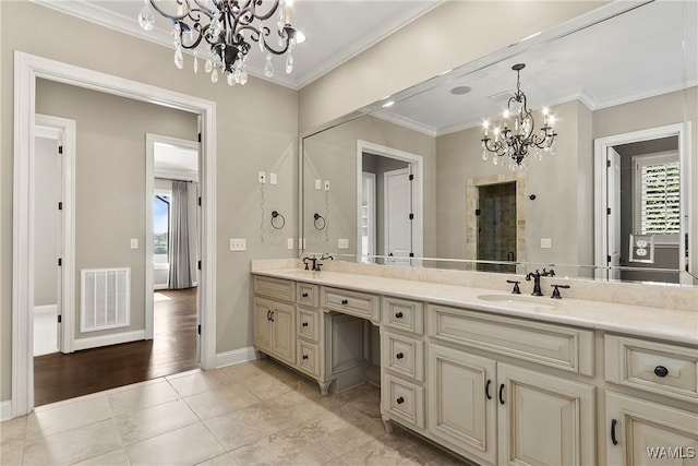 10416 Harbourtowne Dr, Northport, AL 35475 - full bathroom featuring a chandelier, crown molding, double vanity, and tile patterned flooring