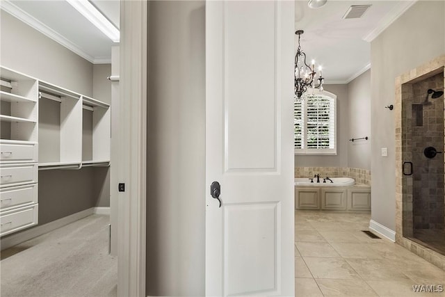 10416 Harbourtowne Dr, Northport, AL 35475 - full bath featuring ornamental molding, a shower stall, a bath, a chandelier, and tile patterned flooring