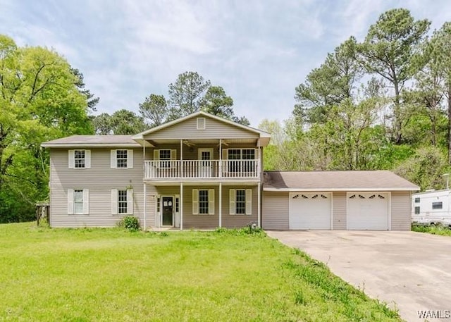 120 John Watkins Ln, Dora, AL 35062 - view of front of house featuring a garage, a front lawn, a balcony, and driveway