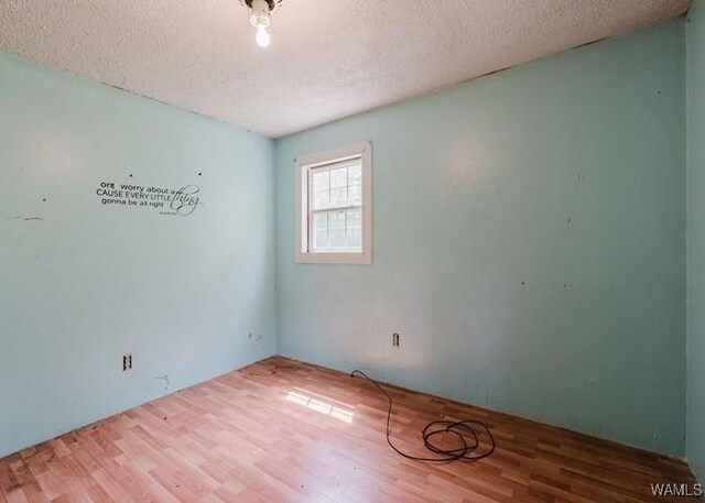 120 John Watkins Ln, Dora, AL 35062 - empty room featuring a textured ceiling and wood finished floors