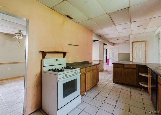 120 John Watkins Ln, Dora, AL 35062 - kitchen with white range with gas stovetop, light tile patterned floors, a ceiling fan, and a paneled ceiling