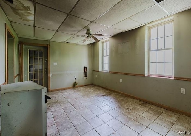 120 John Watkins Ln, Dora, AL 35062 - spare room with light tile patterned floors, ceiling fan, a drop ceiling, and baseboards