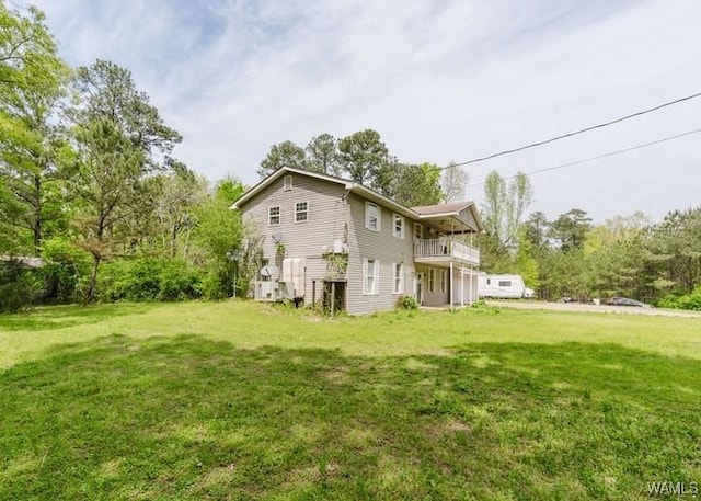 120 John Watkins Ln, Dora, AL 35062 - back of house featuring a balcony and a lawn