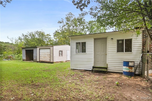 view of outbuilding with a yard