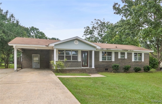 ranch-style home featuring a carport and a front lawn