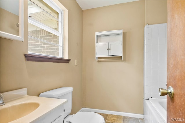 full bathroom featuring vanity, toilet, and tiled shower / bath