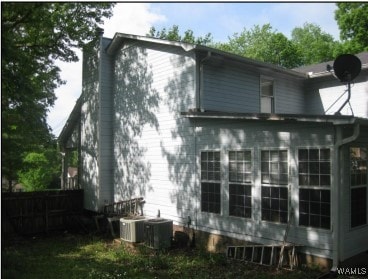 2608 Gable Ct, Centerpoint, AL 35215 - view of property exterior featuring a chimney and a sunroom