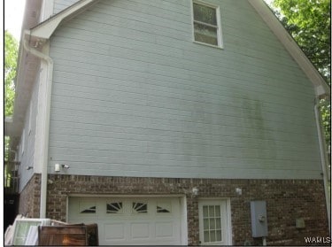2608 Gable Ct, Centerpoint, AL 35215 - view of side of property featuring an attached garage and brick siding