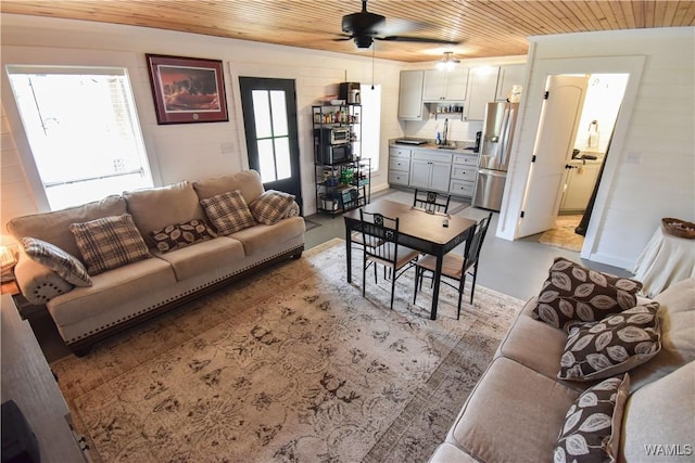 15337 Strawberry Ln, Northport, AL 35475 - living area with wood ceiling, finished concrete floors, ceiling fan, and plenty of natural light