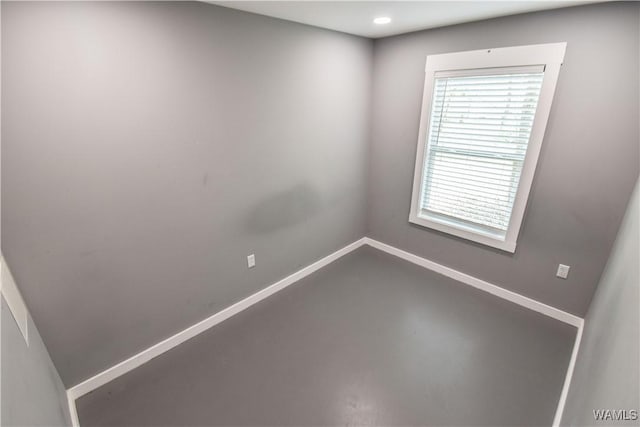 15337 Strawberry Ln, Northport, AL 35475 - empty room featuring recessed lighting, concrete floors, and baseboards
