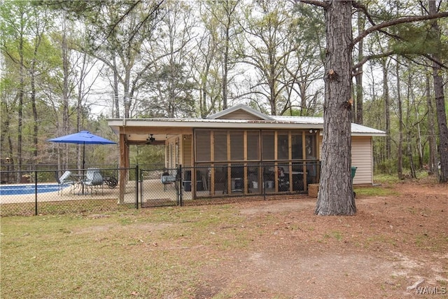 15337 Strawberry Ln, Northport, AL 35475 - exterior space with metal roof, fence, and a sunroom