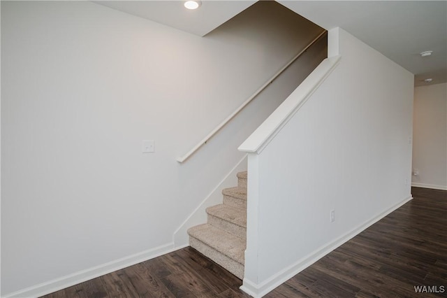 staircase featuring hardwood / wood-style flooring