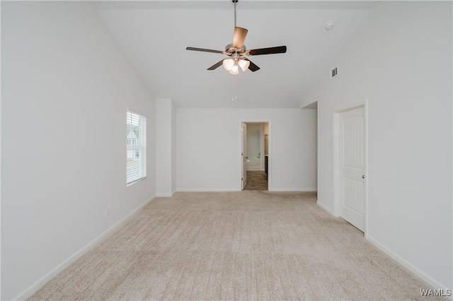 unfurnished room with light carpet, high vaulted ceiling, and ceiling fan