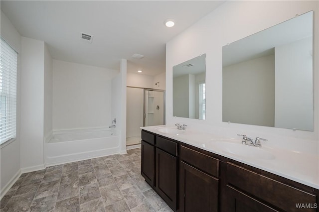 bathroom with separate shower and tub and vanity