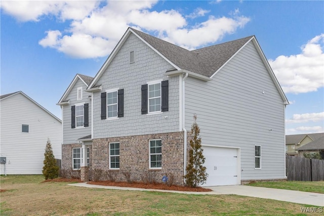 view of front of home with a garage and a front lawn