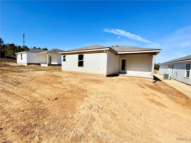 rear view of house with central AC