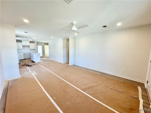 unfurnished living room with ceiling fan