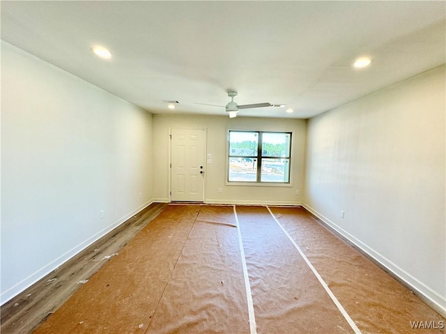 unfurnished room with ceiling fan